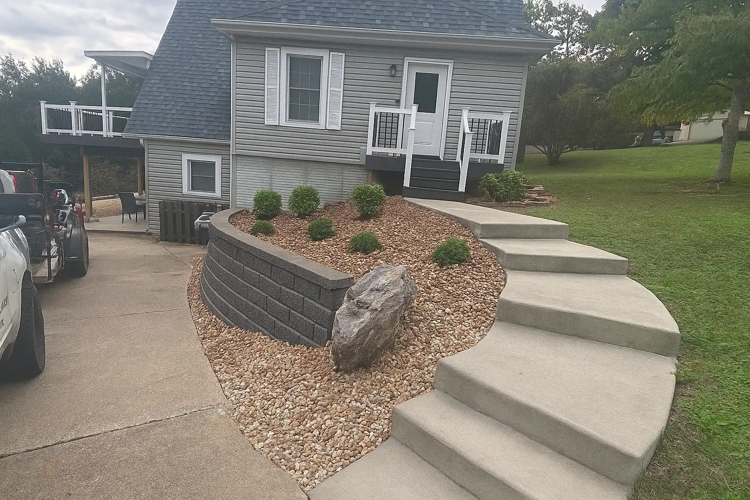 Curved Concrete Steps & Rock Bed